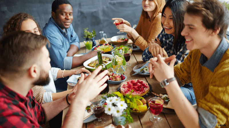 Men and women taking dinner